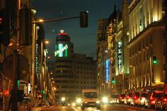 Street view of Gran Vía in Madrid, Spain with bustling traffic and iconic architecture