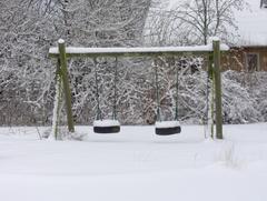 Snow-covered swing set