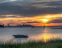 sunset over Boston skyline from Boston Harbor