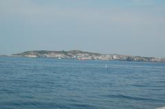 Outer Brewster Island in Boston Harbor with rocky terrain and sparse vegetation