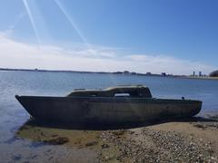 Shipwreck of a Pearson 26 sailboat at low tide