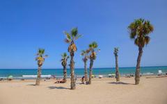 Playa de San Juan in Alicante with a clear sky and calm waves