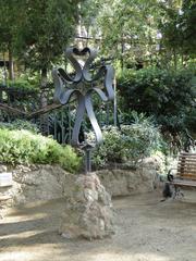 Four-armed cross at the Miralles estate entrance in Parc Güell, Barcelona