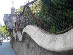 Undulating gate and wall of Finca Miralles in Barcelona