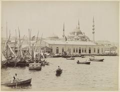 View of the Yeni Valide Mosque in Istanbul with boats in the foreground