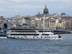 Ferry Kaptan Ilyas Mert in front of Galata Bridge and Tower