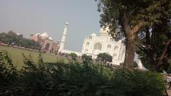 aerial view of the Taj Mahal with well-maintained gardens and surrounding landscapes