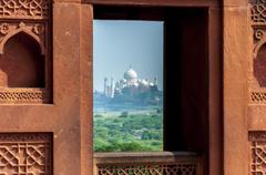 view of Taj Mahal from a window in Agra Fort