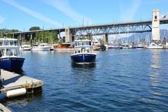 False Creek Ferry Spirit of Nora O'Grady approaching Granville Island with Burrard Bridge in the background