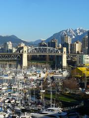 Burrard Bridge in Vancouver at dusk with reflections on the water