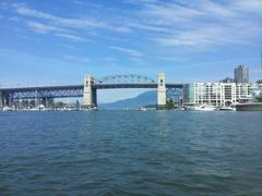 Burrard Bridge with Stanley Park and mountains in background