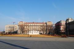 Kossuth Square in Budapest with historical buildings and a clear blue sky