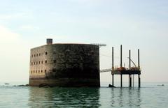 Fort Boyard in the middle of the sea with clear blue skies