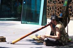 street musician playing didgeridoo in Melbourne