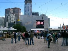 Federation Square in Melbourne with unique architecture and people walking