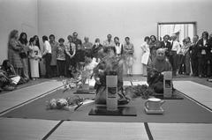 Visitors observing Ikebana demonstration at Stedelijk Museum