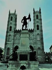 Maisonneuve Monument and Notre-Dame Basilica at Place d'Armes in Montreal