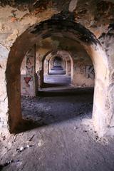 Interior view of Fort Prokocim with stone walls and arched ceilings