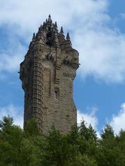 Wallace Monument in Scotland against a cloudy sky