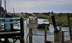 La Seudre at high tide with oyster farmer's flat-bottomed barge