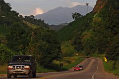 BR-262 highway entering Manhuaçu with Pico da Bandeira in the background