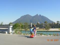 a panoramic view of Sta Lucia, Philippines, featuring lush greenery, mountainous landscapes, and clear blue skies