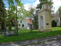 Jenštejn village square with historic buildings and park