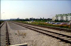 Marchegger Ostbahn near Hausfeldstraße in Vienna with two sidings of the company Konsum visible on the left, looking towards the city