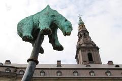 Christiansborg Palace and Jens Galschiøt's 'Unbearable' sculpture in Copenhagen