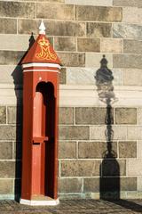 empty leaning sentry box with shadow of a lamp post in Christiansborg, Copenhagen