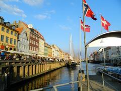 Colorful buildings and boats along Nyhavn canal in Copenhagen