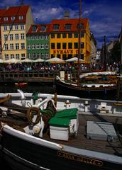 Nyhavn in Copenhagen with colorful buildings and boats along the canal