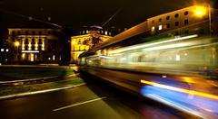 Night Rush in Munich with a tram at Karolinenplatz at night