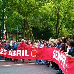 Restauradores Square in Lisbon, Portugal with people celebrating April 25 Revolution