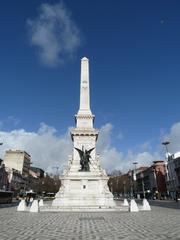 Praça dos Restauradores in Lisbon with a prominent obelisk and historical buildings