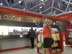 Rebecca waiting at a post office in Lisbon