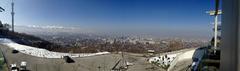 Arial view of Almaty city with mountains in the background