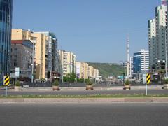 Samal District in Almaty with urban buildings and clear sky