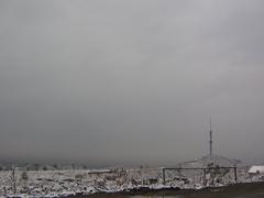 Panoramic view of Almaty cityscape with mountains in the background