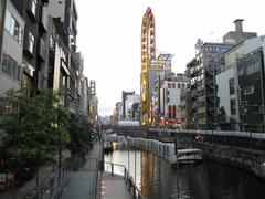 Dotonbori at night with neon lights and reflections on the water