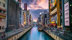 Dotonbori at night with neon signs and reflections in the water