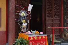 Jade Buddha Temple in Shanghai, China at dusk with lighting highlighting architectural details