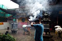 Faithful praying in Jade Buddha Temple in Shanghai