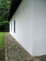 Front facade and side stone pavement of Casa do Bandeirante in Butantã, São Paulo, Brazil