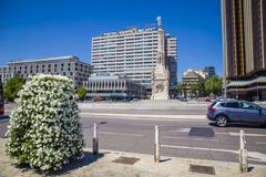 A scenic view of the City of Madrid with historical buildings and lush greenery