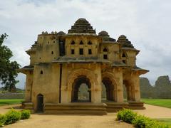 A scenic view of Hampi with ancient ruins and rocky terrain