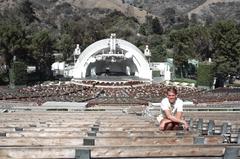 Hollywood Bowl at night with city lights in the background