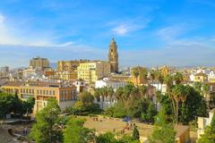 aerial view of Malaga city center with historical buildings and Mediterranean coastline