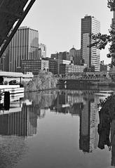 Chicago Loop 1978 viewed from LaSalle Street bridge featuring Wells Street Railroad bridge and reflections on Chicago River