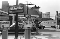 Man posing in Amoco gas station, Chicago, April 1979